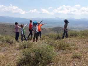 Children posing on the mountain side