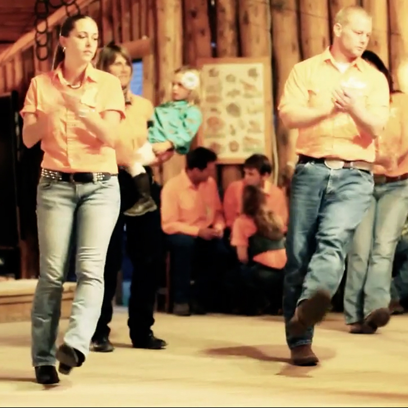 Evening line dance group activity in the dance hall